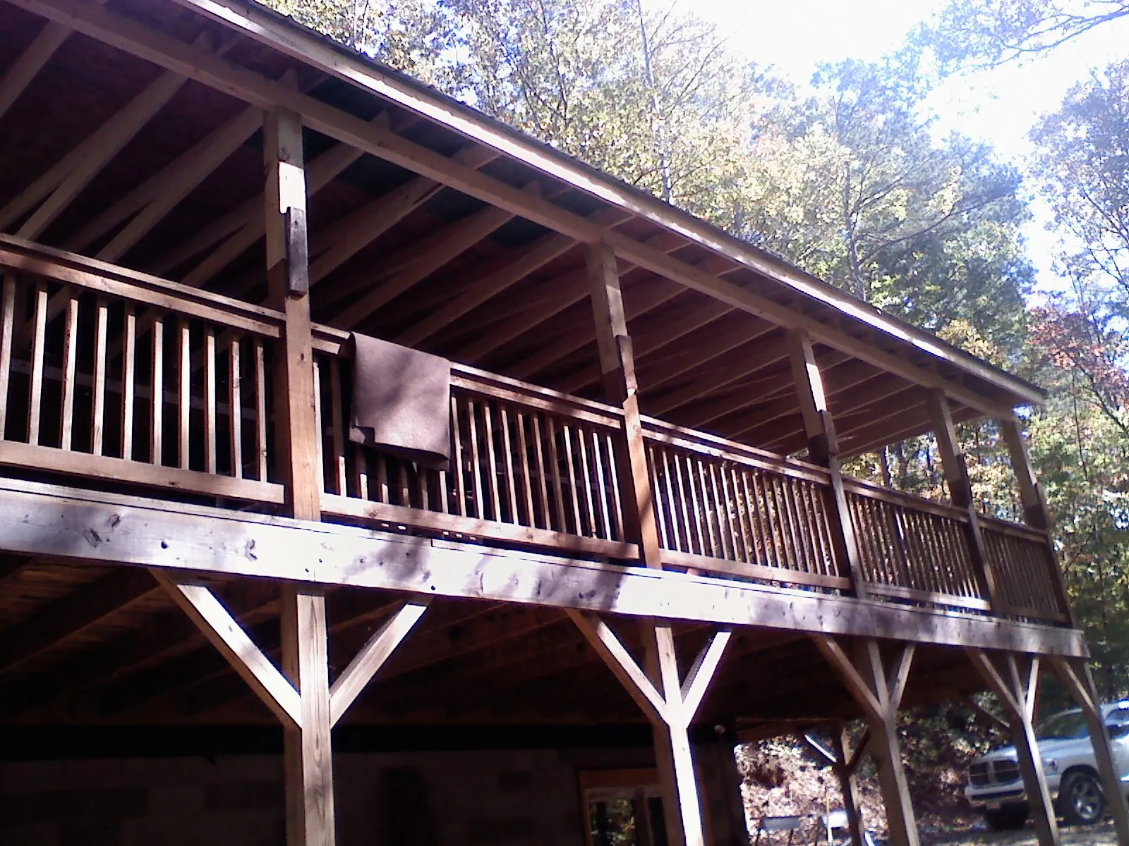Timber framing under a new elevated porch and deck — Roof Leak Repair in Trade by Roofing Brothers